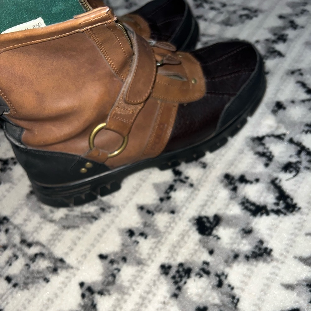 Brown polo boots with the zippers